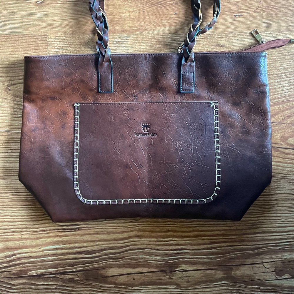 Weimbibaige faux bag. New condition-only tags removed-not used.